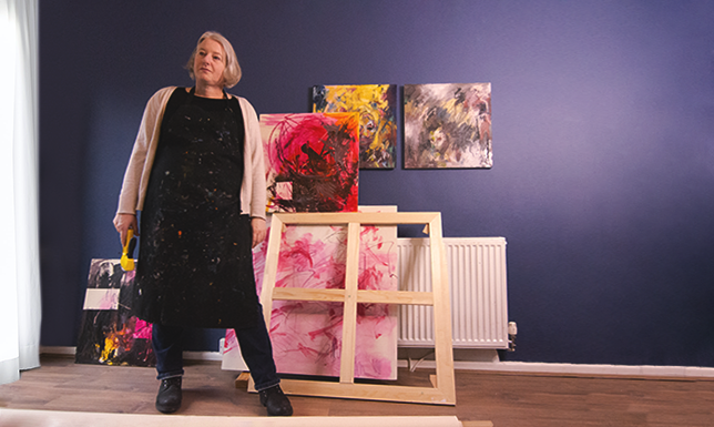 Self portrait of Gayle standing in her studio